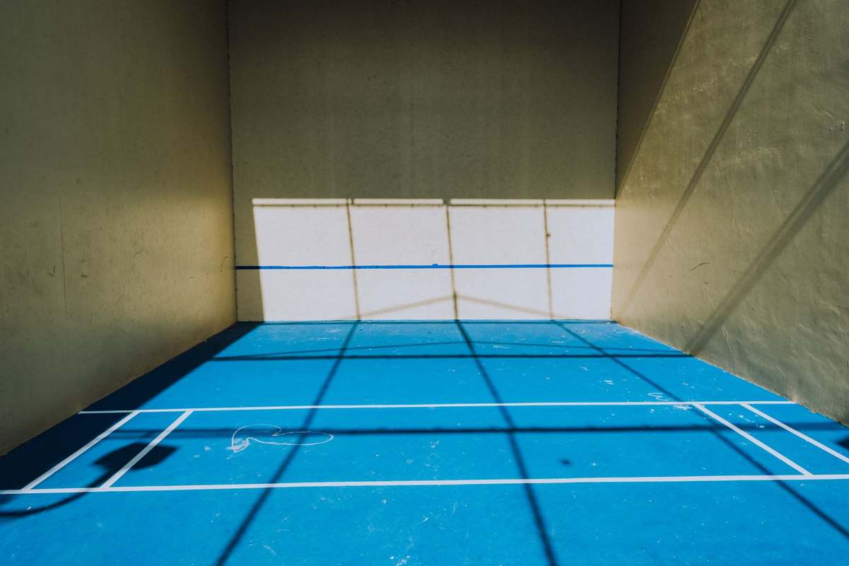 Hotel pickleball court with painted lines on a cushioned hard court surface