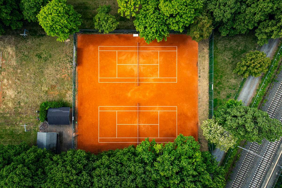 Two tournament-specification pickleball courts laid out side by side